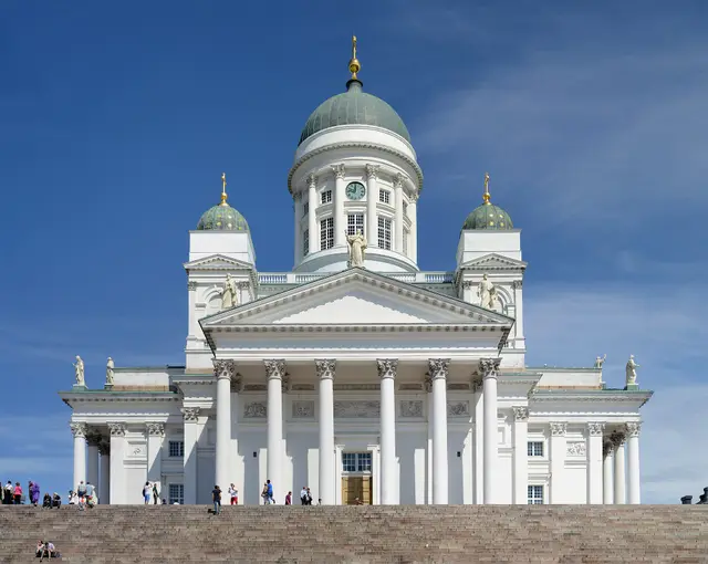 Helsinki’s white cathedral with green domes, above a flight of steps.
